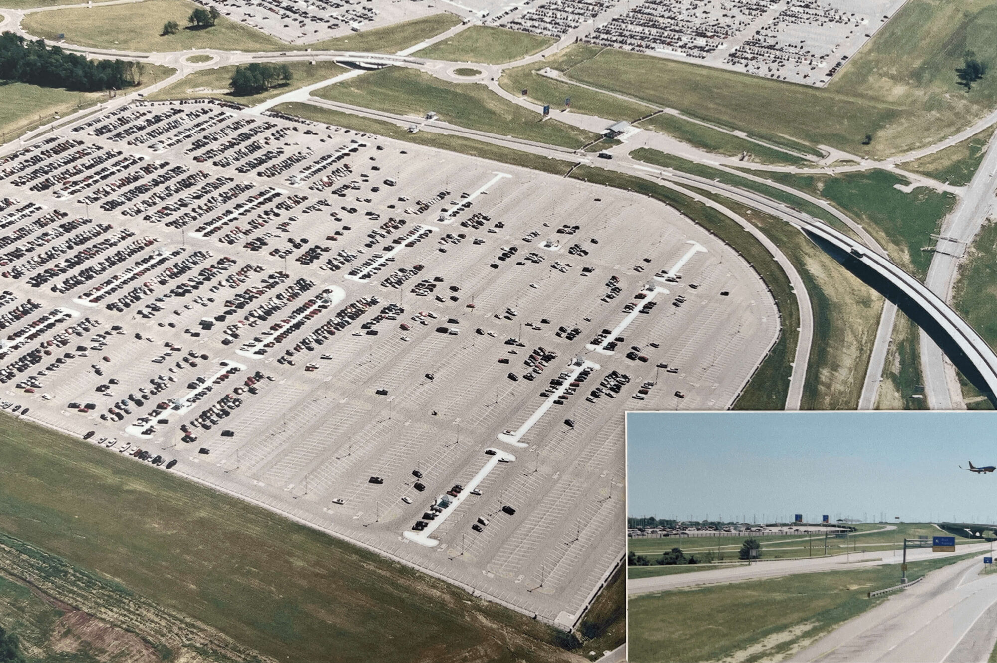 Aerial view of a full parking lot by highways; plane inset.