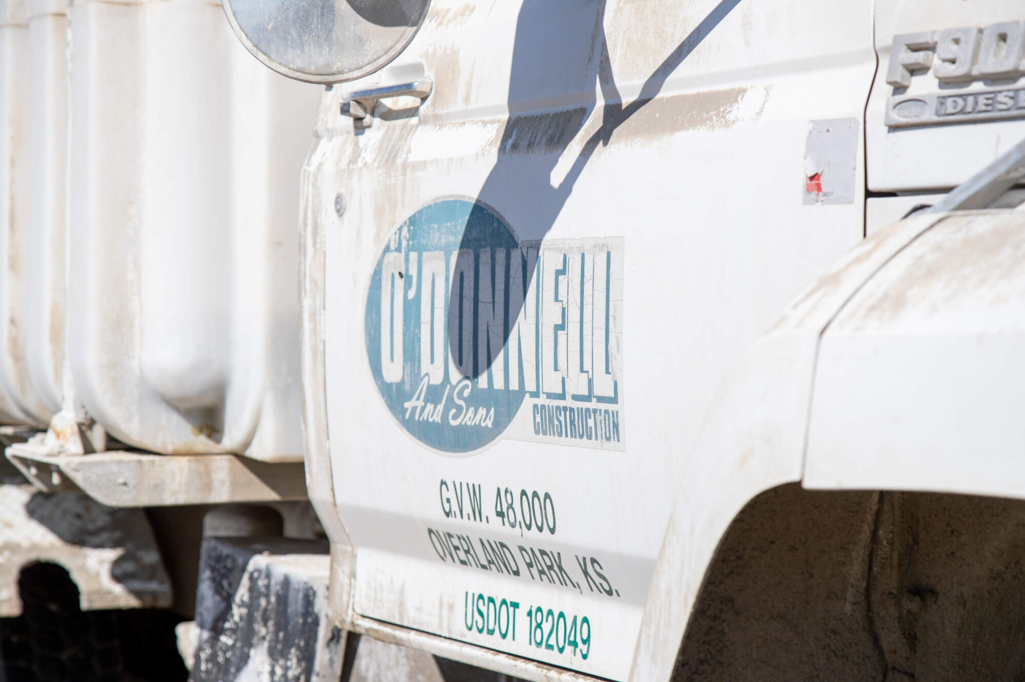 White construction truck with ODonnell and Sons logo and details.