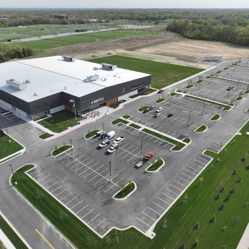 A building with two parking lots