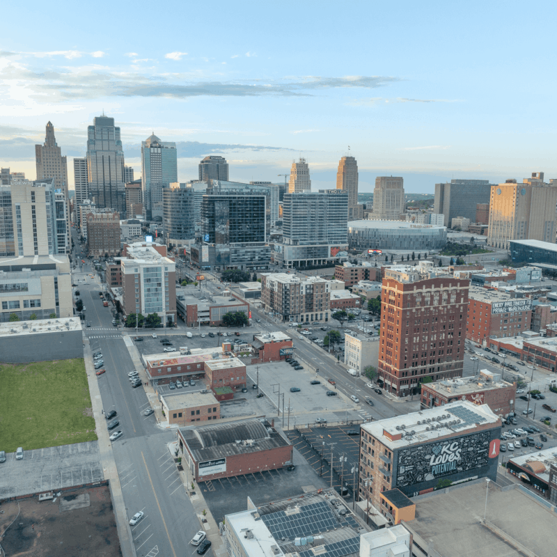 Aerial view of downtown Kansas City with buildings and mural.